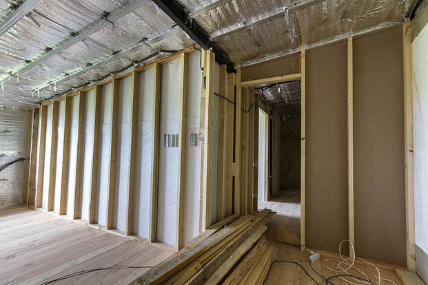 A basement room in Fairfield, CT, insulated with silver aluminum foil on the walls.